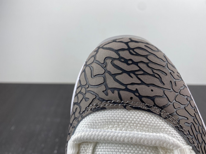Air Jordan 11 Low "Cement Grey" AV2187-140.